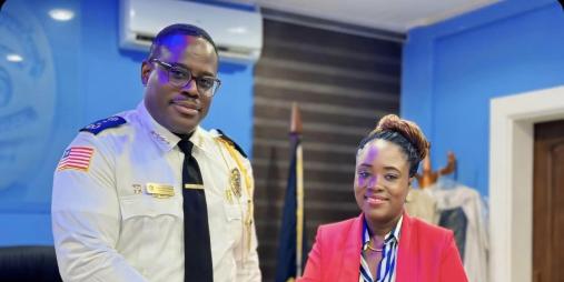 The Liberia Anti-Corruption Commission (LACC) Executive Chairperson, Cllr. Alexandra Kormah Zoe, shakes hands with Honorable Gregory Coleman, the Inspector General of the Liberian National Police.